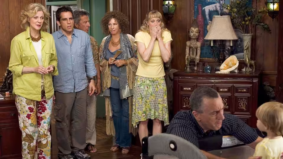 Dina, Greg, Bernie, Roz, and Pam react as Jack crouches beside a child in the living room