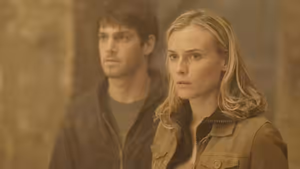 Abigail Chase (Diane Kruger) and Riley Poole (Justin Bartha) stand amid dusty haze