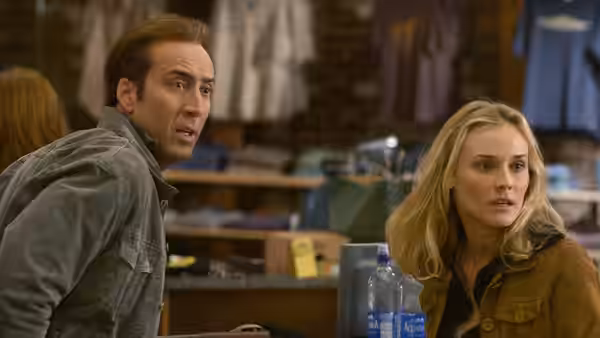 Ben Gates (Nicolas Cage) and Abigail Chase (Diane Kruger) react inside a cluttered shop