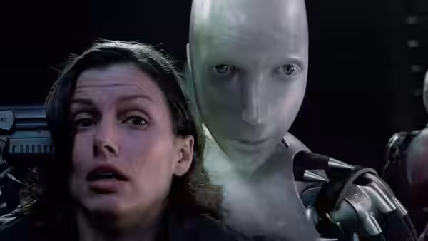 Susan Calvin (Bridget Moynahan) stands close beside Sonny in a dim room