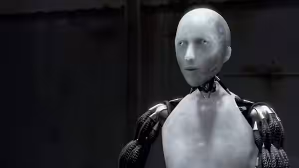Sonny stands alone in a dark industrial room