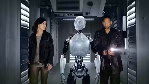Susan Calvin (Bridget Moynahan) and Del Spooner (Will Smith) walk with Sonny through a corridor
