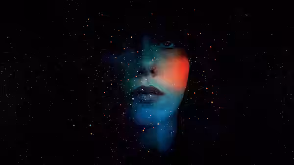 Scarlett Johansson with blue and red light on her face in darkness