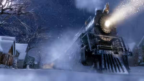 A steam locomotive advances through a snow-covered village at night
