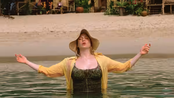 Bridget Jones (Renée Zellweger) stands waist-deep in water with her arms outstretched