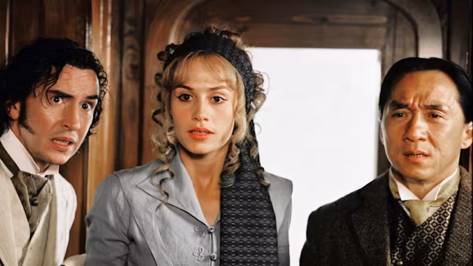 Inspector Fix (Ewen Bremner), Monique La Roche (Cécile de France) and Passepartout (Jackie Chan) look ahead inside a carriage