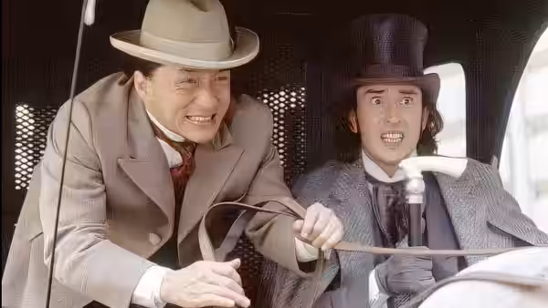 Passepartout (Jackie Chan) and Phileas Fogg (Steve Coogan) grip the reins inside a carriage