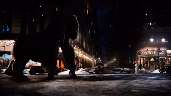 Kong towers over a snow-covered New York street as Ann Darrow faces him