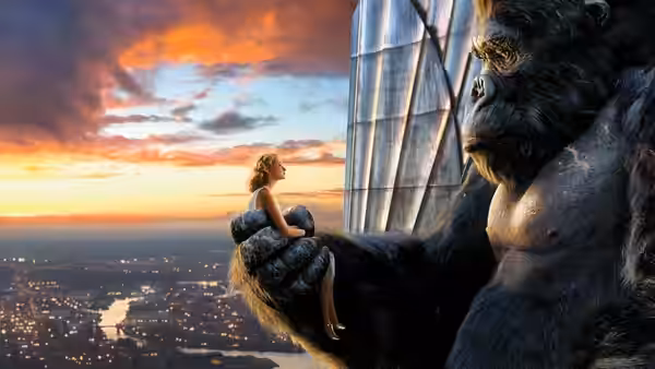 Kong cradles Ann Darrow above the city skyline at sunset