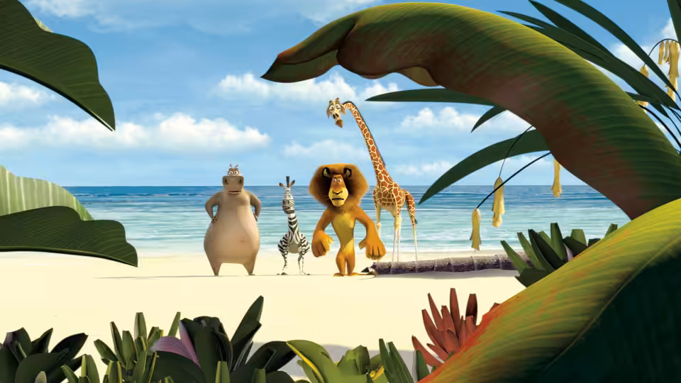 Alex, Marty, Melman, and Gloria stand together on a tropical beach framed by broad leaves