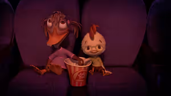 Abby Mallard and Chicken Little sit together in a movie theater with popcorn
