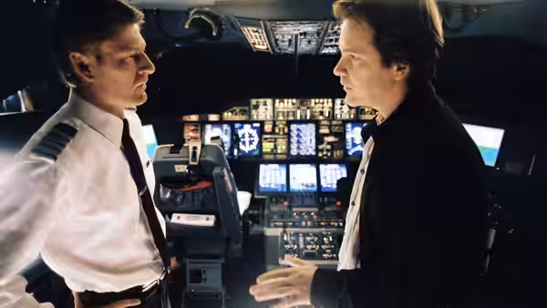 Captain Rich (Sean Bean) faces Carson (Peter Sarsgaard) in the cockpit