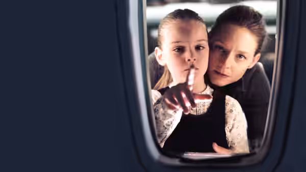 Kyle (Jodie Foster) and Julia (Marlene Lawston) peer through a small window