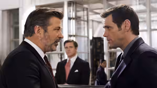 Jack McCallister (Alec Baldwin) confronts Dick Harper (Jim Carrey) in an office lobby