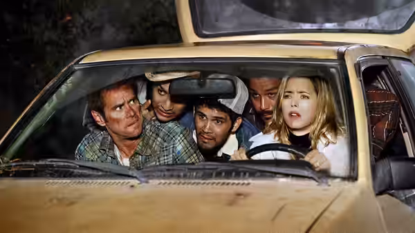 Dick and Jane Harper cram into an old car with several companions