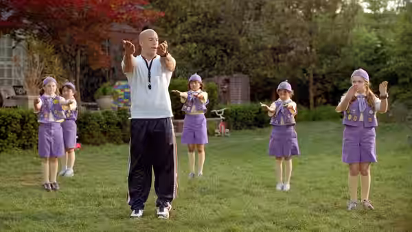 Shane Wolfe (Vin Diesel) leads young girls in a backyard fitness drill