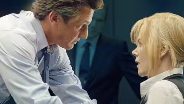 Tobin Keller (Sean Penn) leans toward Silvia Broome (Nicole Kidman) in a room