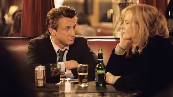 Tobin Keller (Sean Penn) and Silvia Broome (Nicole Kidman) talk over drinks at a bar