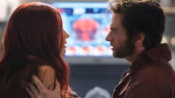 Logan (Hugh Jackman) holds Jean Grey (Famke Janssen) by the shoulders as they face each other
