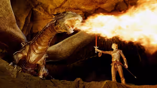 Eragon (Ed Speleers) raises a sword as Saphira breathes fire in a cavern