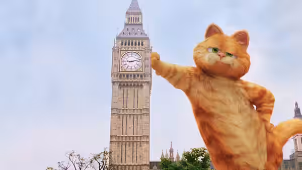 Garfield reaches toward Big Ben, towering beside the clock tower in London