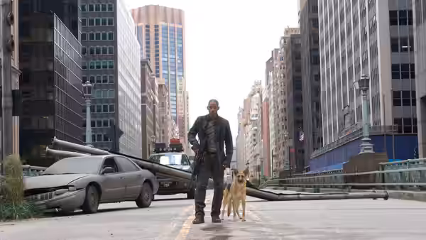 Robert Neville (Will Smith) stands with his dog on an abandoned city street