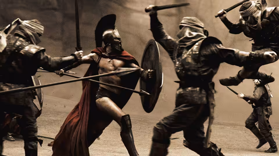 Leonidas (Gerard Butler) fights armored Persian soldiers with his shield and spear