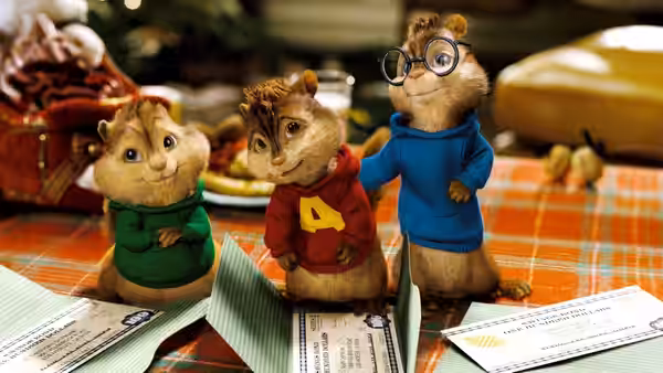 Alvin, Simon and Theodore stand among papers on a dining table