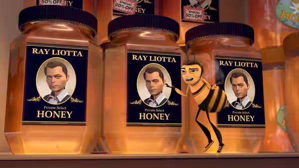 Barry stands among jars of Ray Liotta brand honey on a store shelf