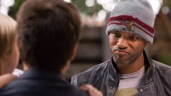 John Hancock (Will Smith) faces a man during a conversation