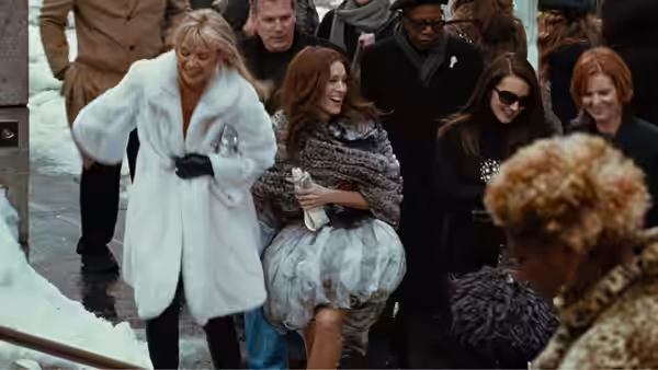 Samantha Jones (Kim Cattrall), Carrie, and friends gather outside in winter clothing