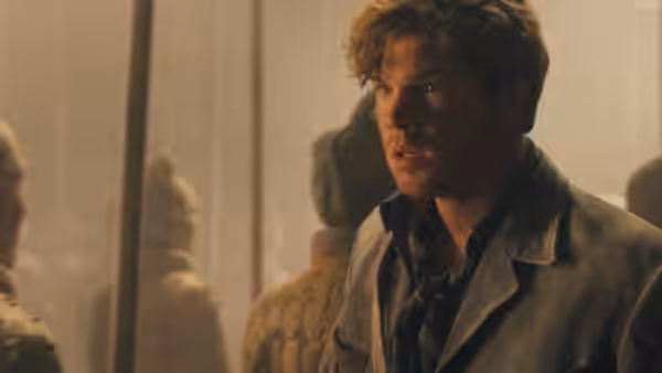 Alex O'Connell (Luke Ford) stands among terracotta warriors in a dusty hall