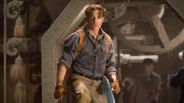 Alex O'Connell (Luke Ford) strides through an ornate interior with a backpack