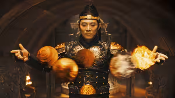 Han (Jet Li) stands in an underground chamber, levitating glowing spheres around him