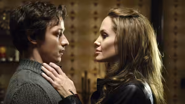 Fox (Angelina Jolie) rests a hand on Wesley Gibson’s shoulder as they face each other