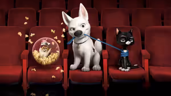 Bolt sits between Mittens and Rhino in a theater, holding a leash in his mouth