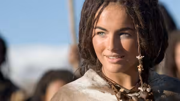 Evolet (Camilla Belle) looks toward someone in a crowd