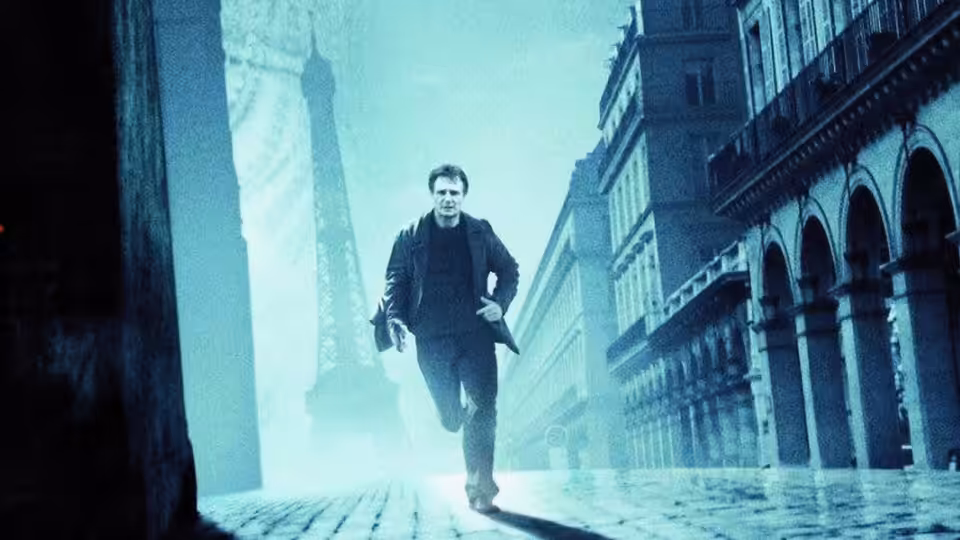 Bryan Mills (Liam Neeson) runs along a misty Parisian street