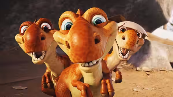 Three young dinosaurs crowd together on rocky ground