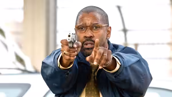 Walter Garber (Denzel Washington) points a handgun and signals for someone to stop