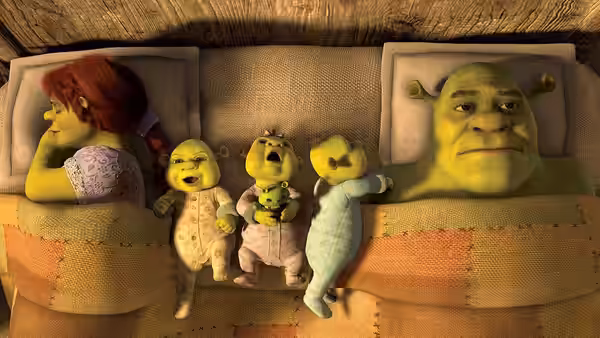 Fiona, Shrek and their three ogre children lie together in bed