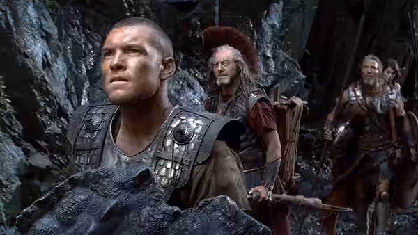 Perseus (Sam Worthington) leads armed warriors through a narrow rocky passage