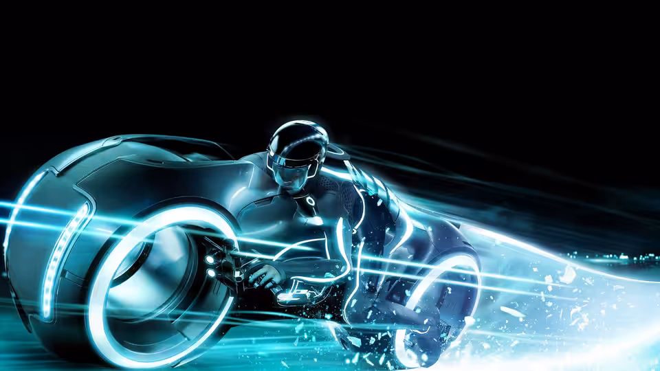 A helmeted rider speeds on a glowing light cycle through the Grid