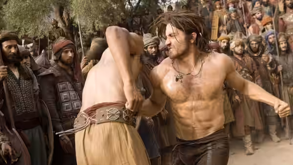 Prince Dastan (Jake Gyllenhaal) grapples with a man before a watching crowd