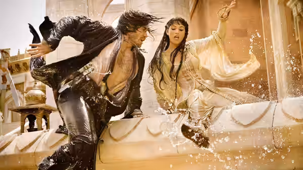 Prince Dastan (Jake Gyllenhaal) and Tamina (Gemma Arterton) splash through a fountain