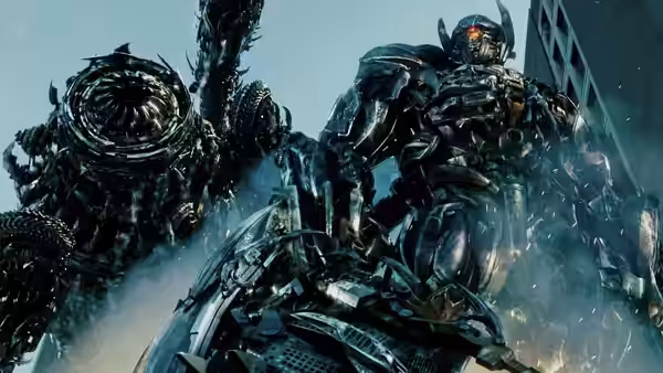 Optimus Prime fights a spiked Decepticon amid smoke and shattered debris