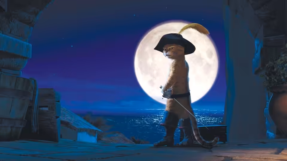 Puss in Boots stands silhouetted against the full moon beside a seaside doorway