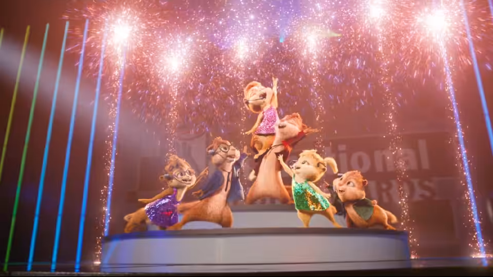 The Chipmunks and Chipettes perform together beneath sparkling stage lights