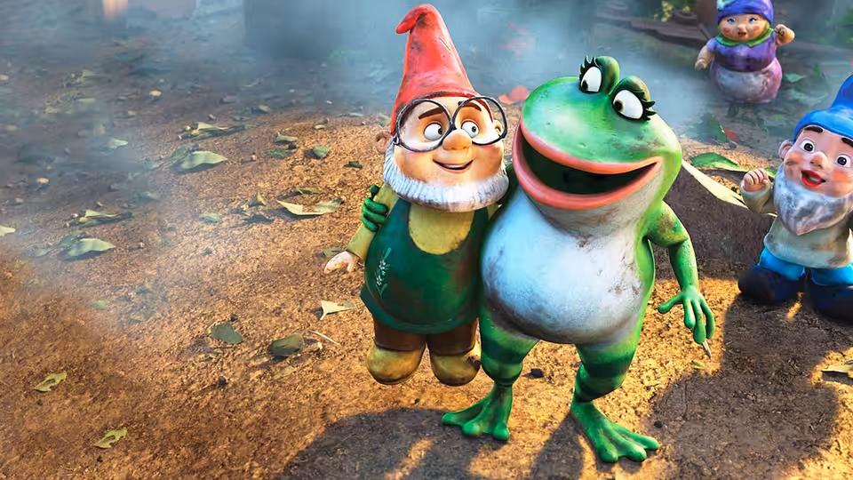 A garden gnome stands arm-in-arm with a smiling frog among scattered leaves