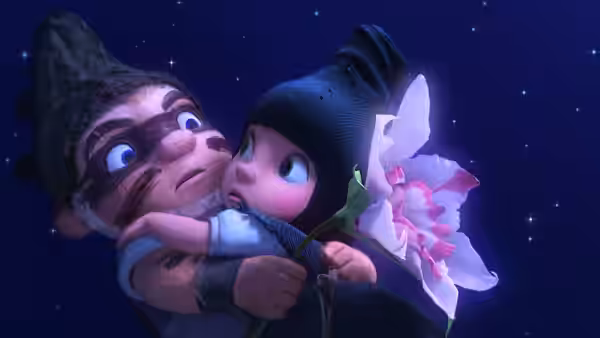 Gnomeo and Juliet embrace beneath a starry sky, holding a pink flower
